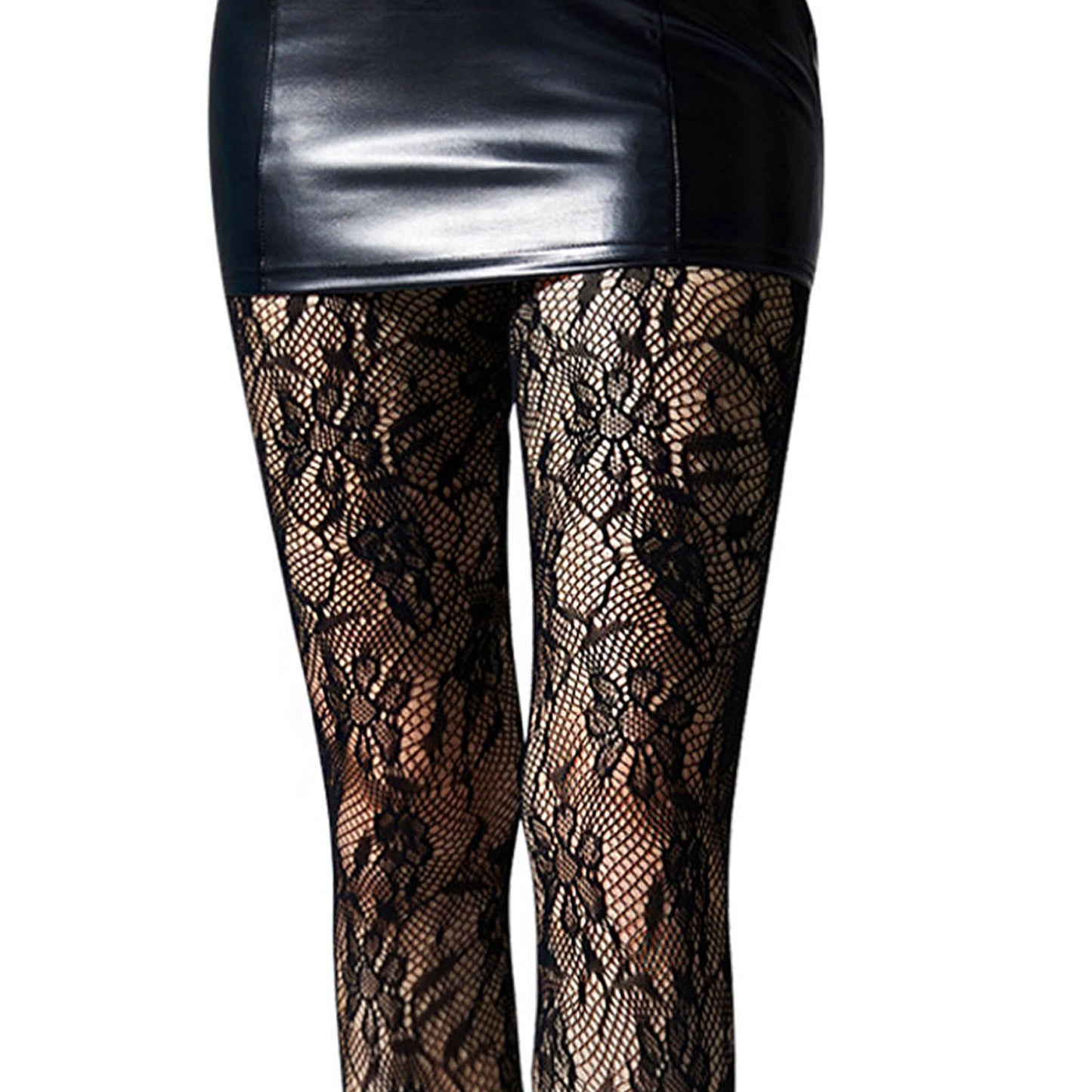 Black lace tights worn over a black leather skirt
