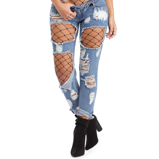 wide whale net tights worn with ripped jeans