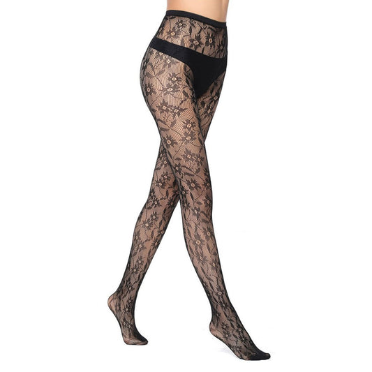 A woman in black patterned fishnet tights with a daisy floral print 
